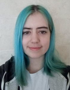 photograph of a young woman with blue hair